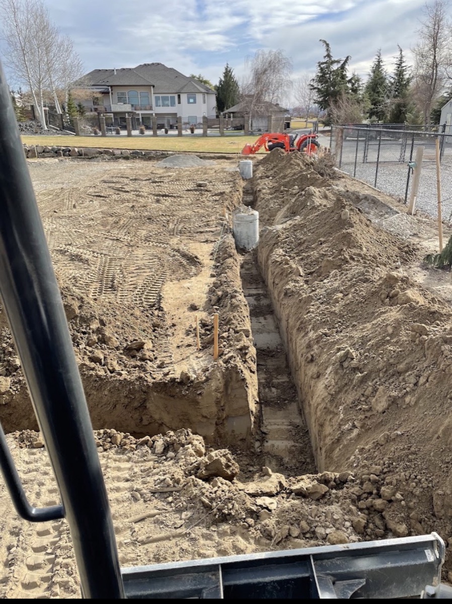 Residential excavation trench and site preparation with compact equipment
